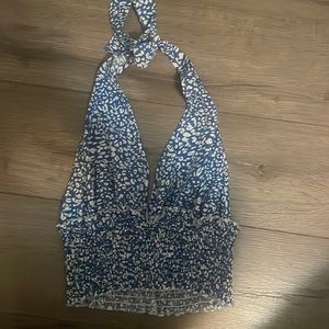 This is a blue crop open back with tie top it was 25 and I’m selling for 15